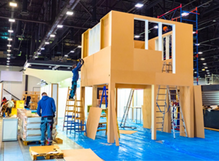 A double-deck stand going up during build-up